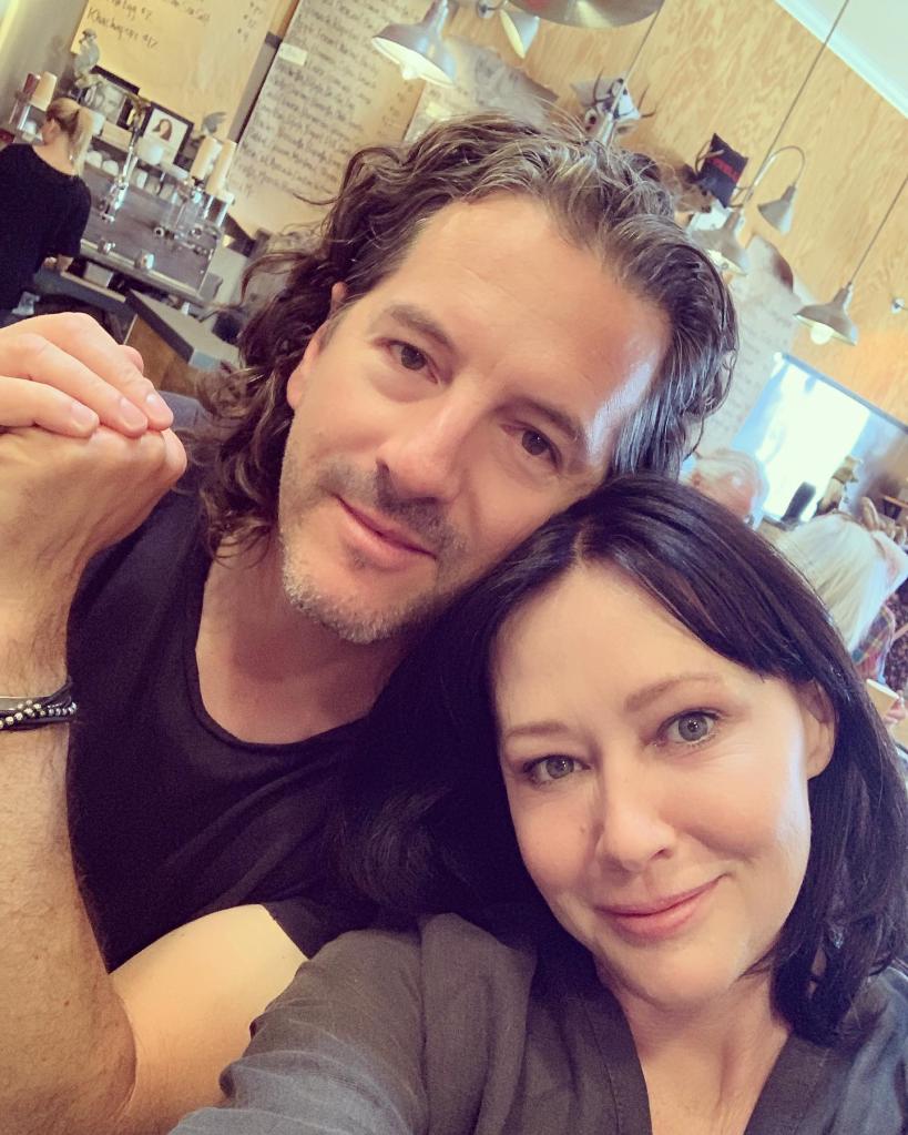 Shannen Doherty and Kurt Iswarienko takes a selfie.