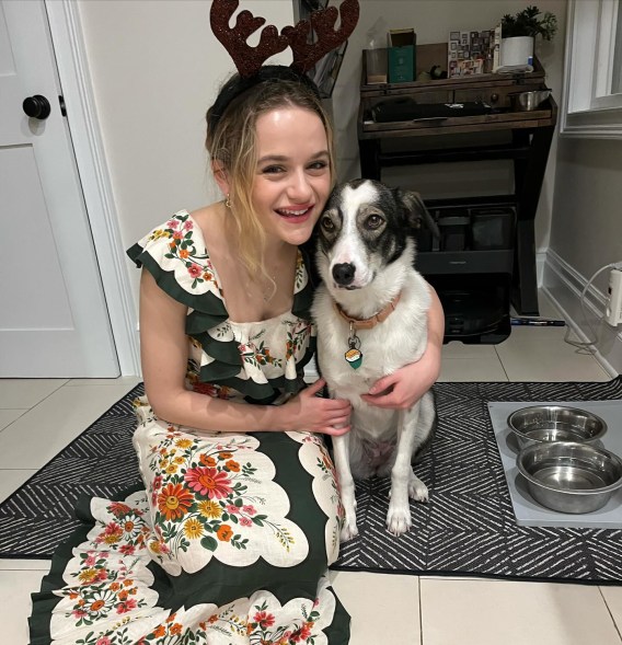 Joey King hugging her dog