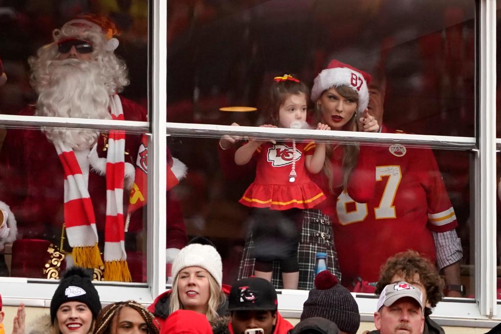 Taylor Swift is seen in a suite before the start of an NFL football game between the Kansas City Chiefs and the Las Vegas Raiders Monday, Dec. 25, 2023, in Kansas City, Mo.