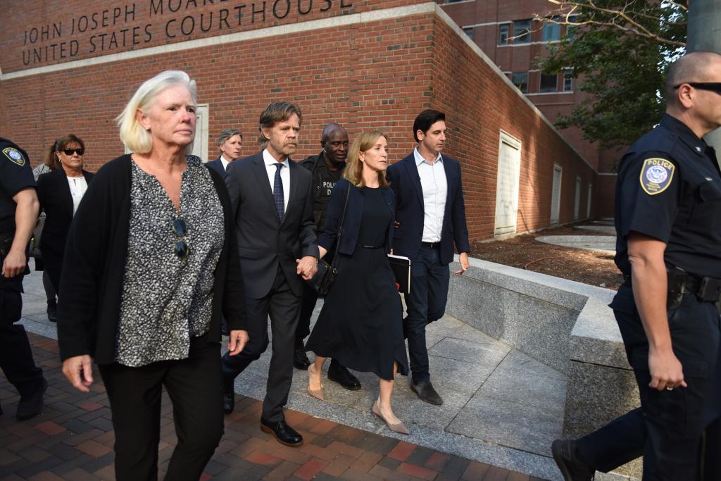 William H. Macy and Felicity Huffman leaving court