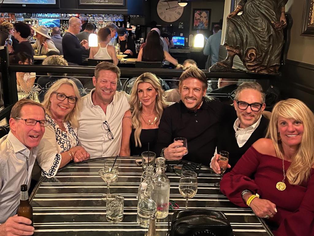 John Janssen hangs with Alexis Bellino at a group dinner