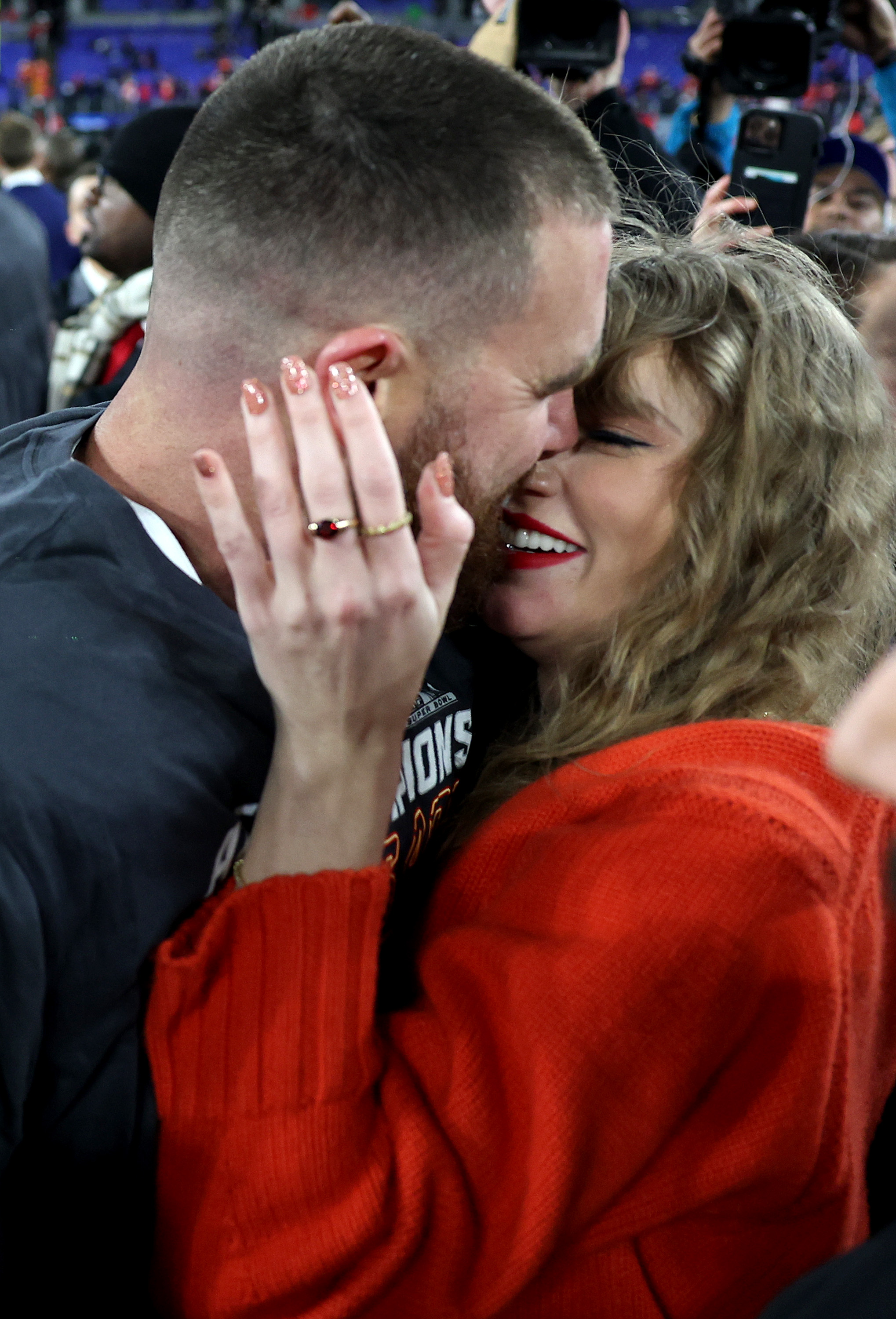 Travis Kelce #87 of the Kansas City Chiefs celebrates with Taylor Swift after a 17-10 victory against the Baltimore Ravens in the AFC Championship Game at M&T Bank Stadium on January 28, 2024 in Baltimore, Maryland.