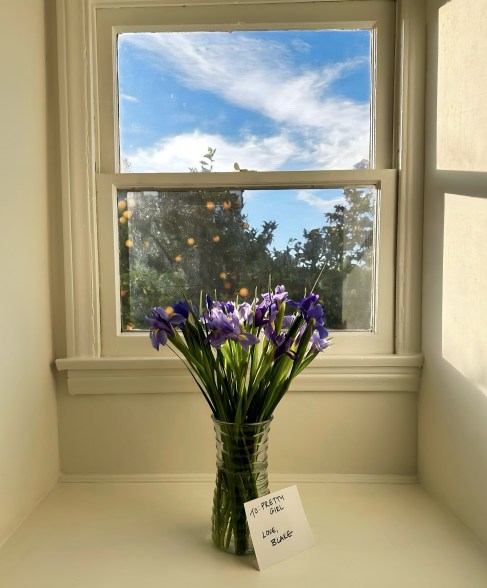 bouquet of flowers in a vase by a window