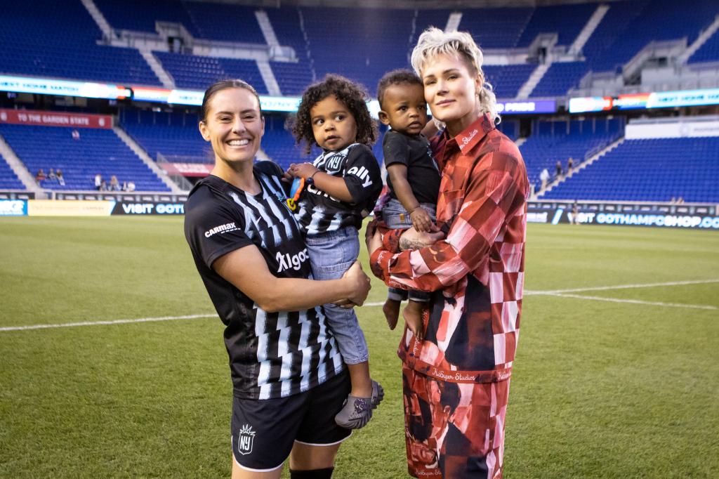Ali Krieger and Ashlyn Harris with their two children