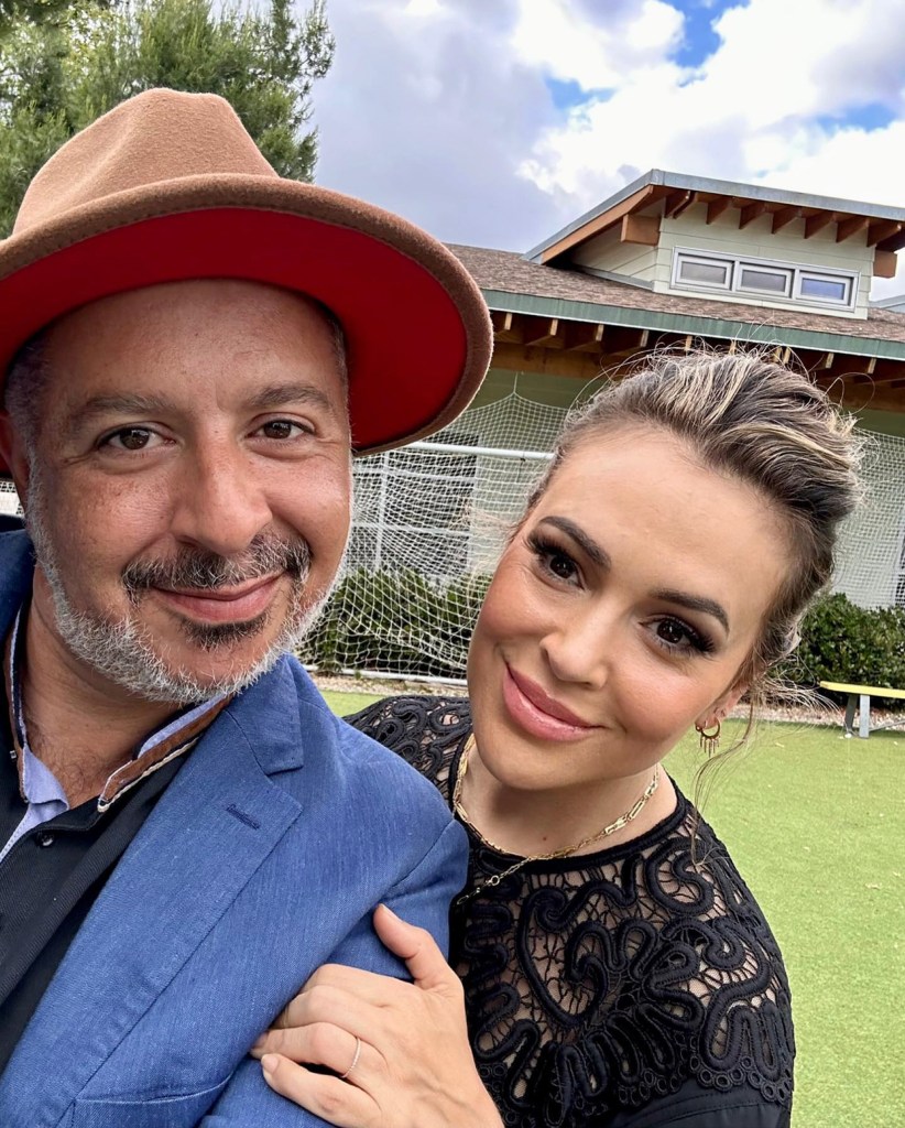 selfie of alyssa milano and her husband in their backyard