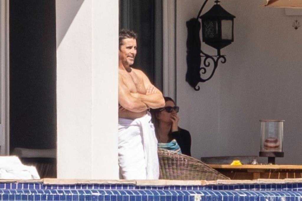 Christian Bale with a towel around his waist.