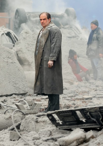 Colin Farrell in rubble dressed as the penguin