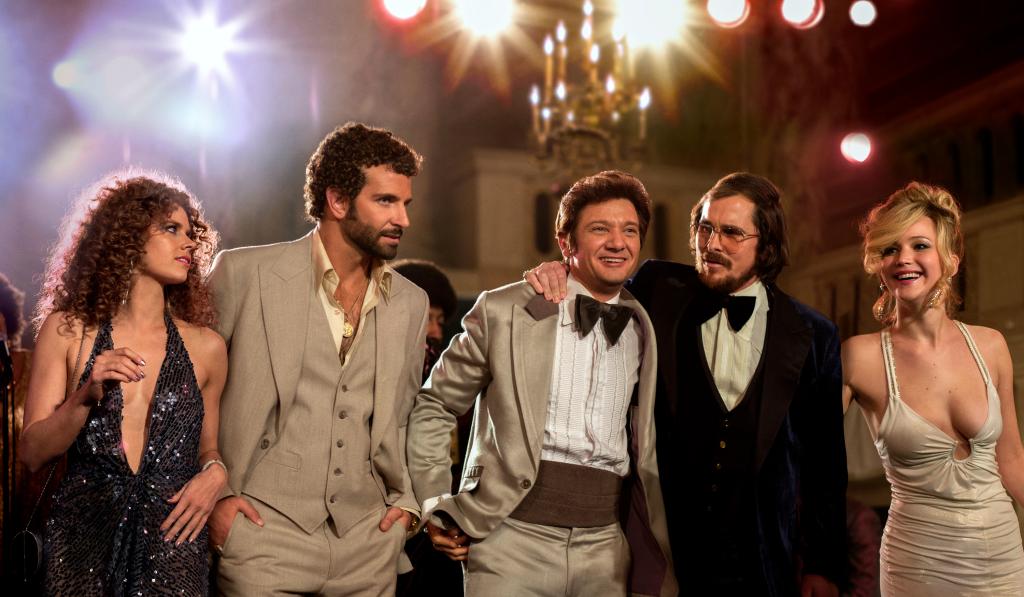 This film image released by Sony Pictures shows, from left,  Amy Adams, Bradley Cooper, Jeremy Renner, Christian Bale and Jennifer Lawrence in a scene from "American Hustle." (AP Photo/Sony - Columbia Pictures, Francois Duhamel)