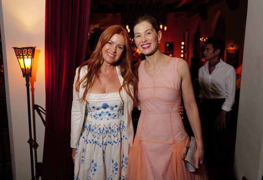 Isla Fisher and Rosamund Pike at The Golden Eve Party held at Chateau Marmont on January 6, 2024 in Los Angeles, California.