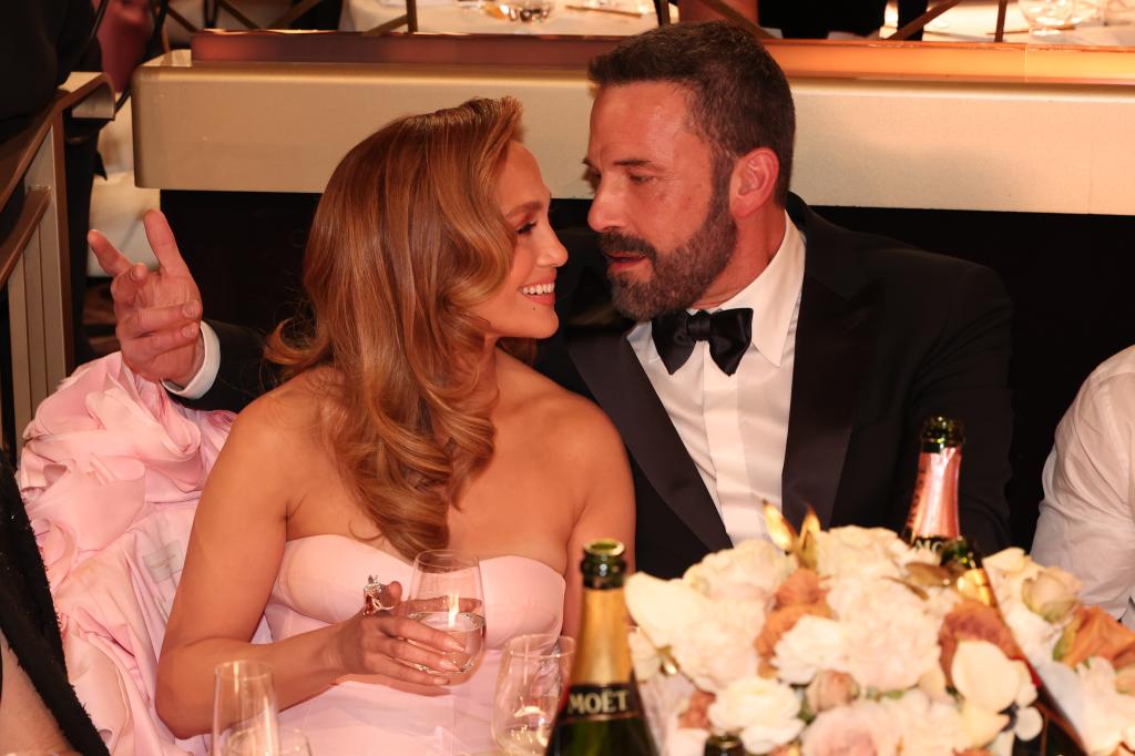 Ben Affleck and Jennifer Lopez sitting at the Golden Globes 2024