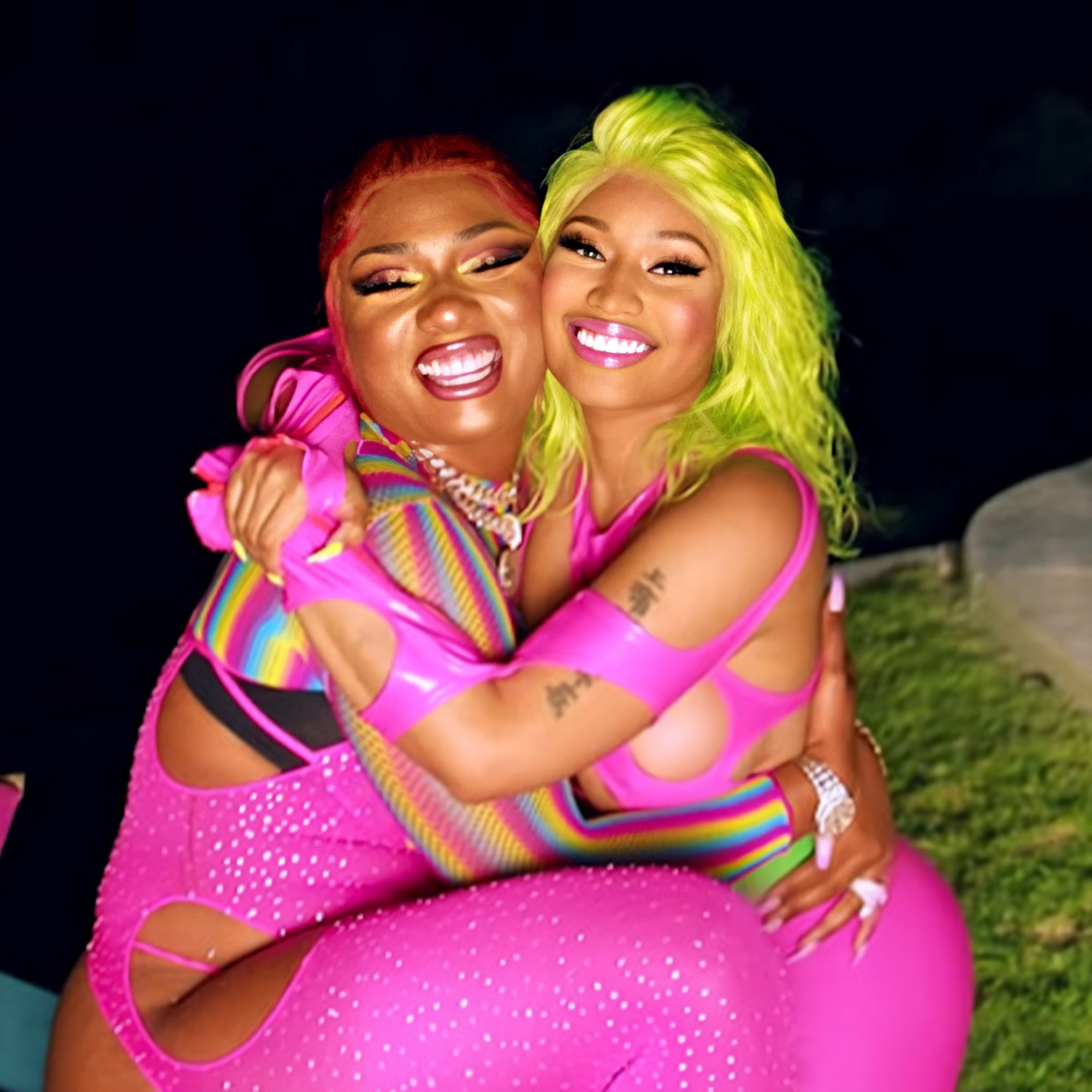 Megan Thee Stallion and Nicki Minaj hugging.