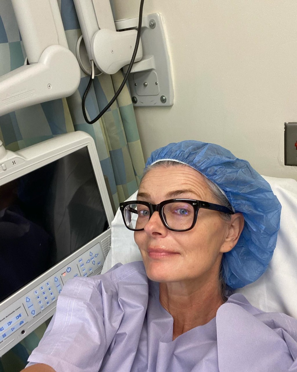 Paulina Porizkova in hospital bed.