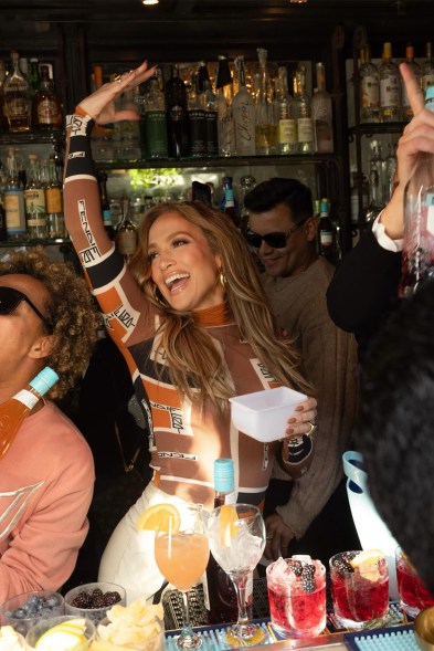 BOTTLE SERVICE: Jennifer Lopez serves a brunch crowd in West Hollywood, Calif., her own brand of bottled cocktails.VF