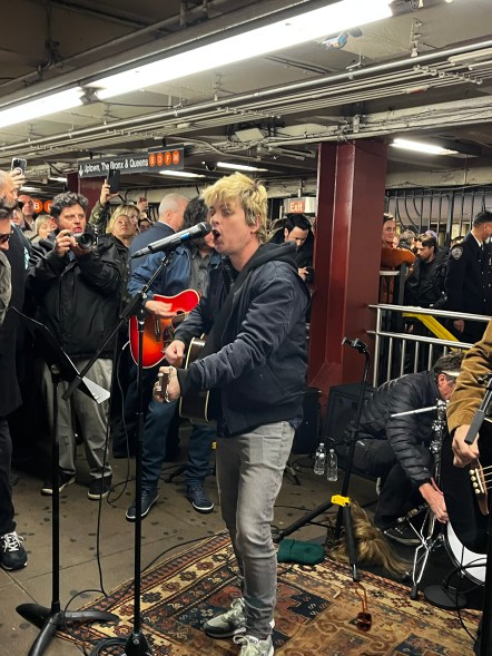 UPTOWN PUNKS: Green Day serenades subway riders at the Rockefeller Center station in Midtown for “The Tonight Show.”