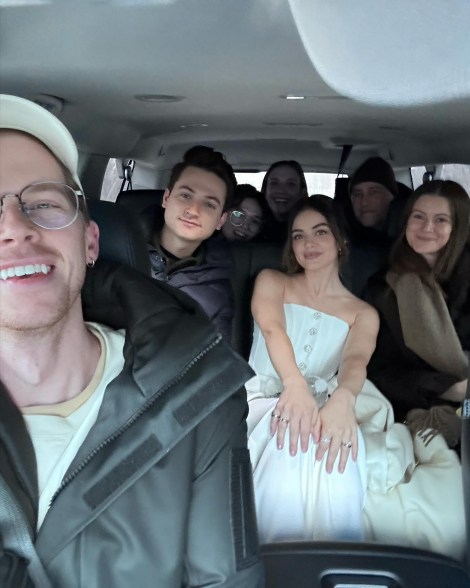Lucy Hale and a group of people piled in an SUV
