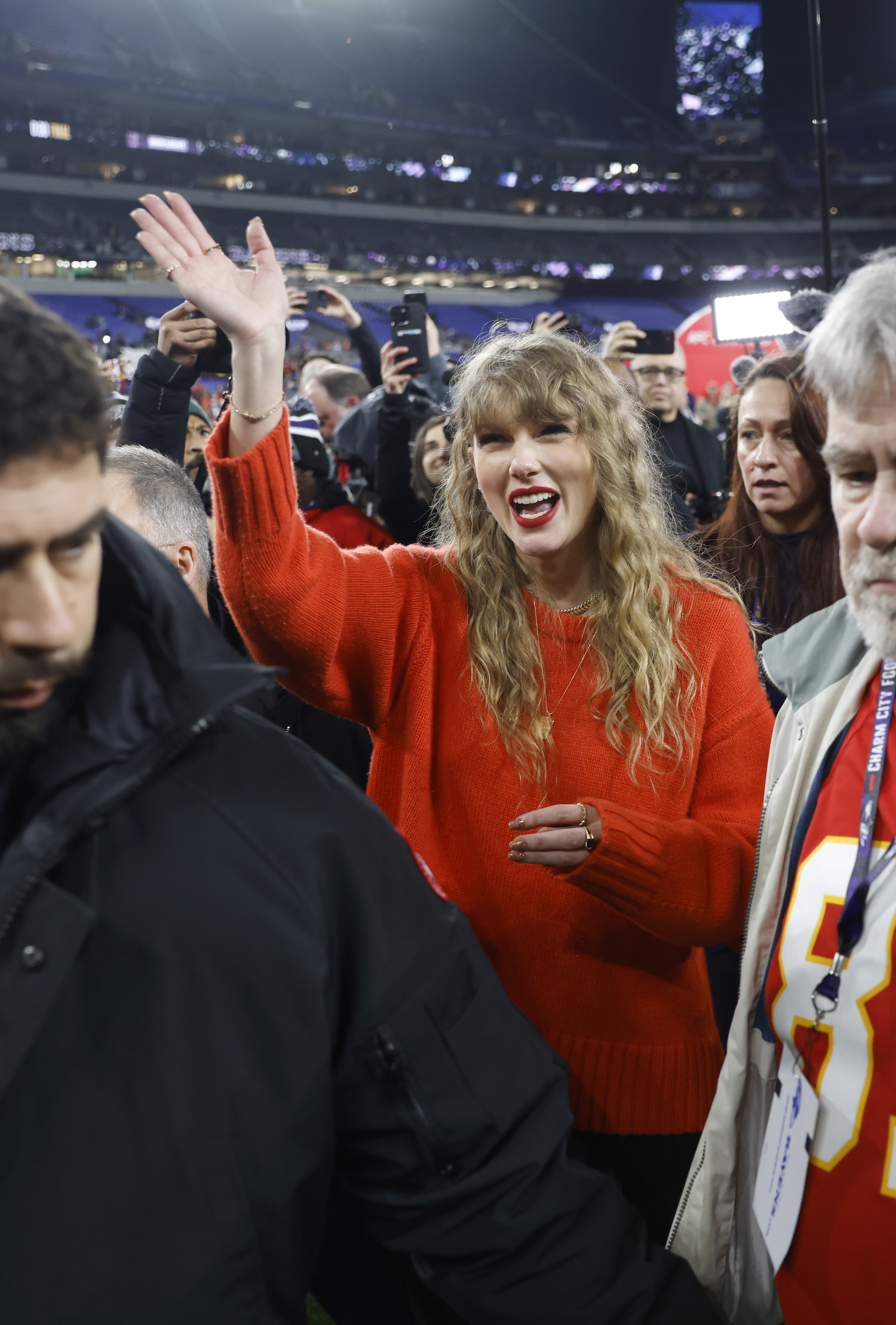 Taylor Swift pictured on the field after the Kansas City Chiefs defeated the Baltimore Ravens in the AFC Championship game at M&T Bank Stadium in Baltimore, MD.