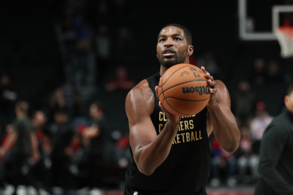 tristan thompson holding a basketball on the court