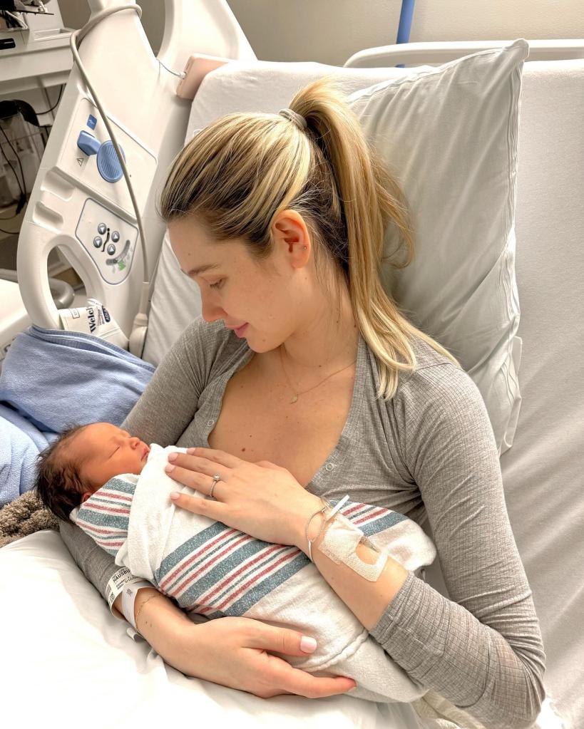 Madisson Hausburg holding her newborn.