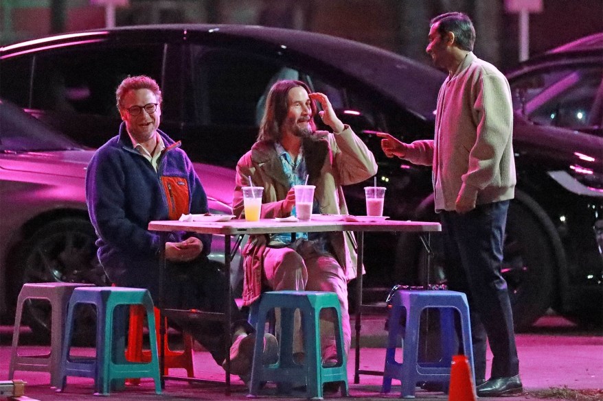 'FORTUNE' TELLER: Seth Rogen (from left) and Keanu Reeves take direction from Aziz Ansari on the Los Angeles set of “Good Fortune.”