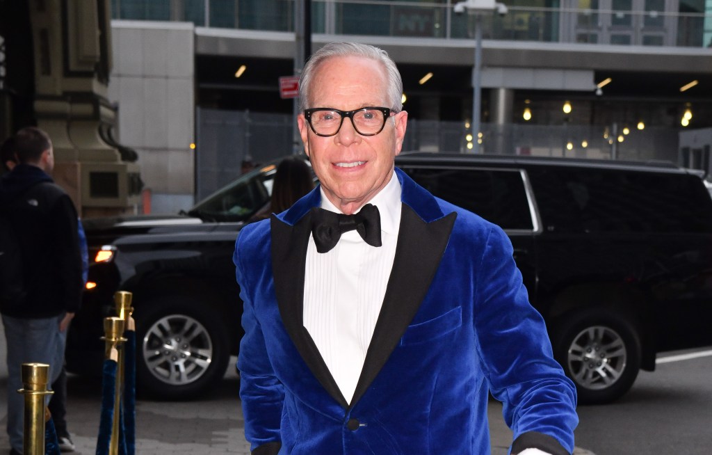 Tommy Hilfiger in navy blue velvet jacket.