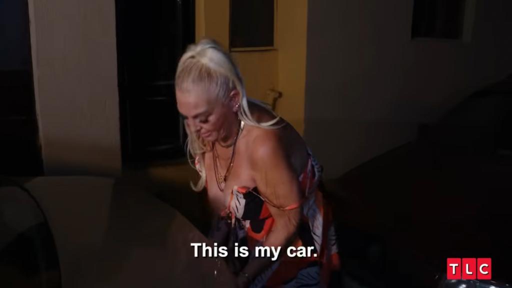Angela Deem breaking apart a car.