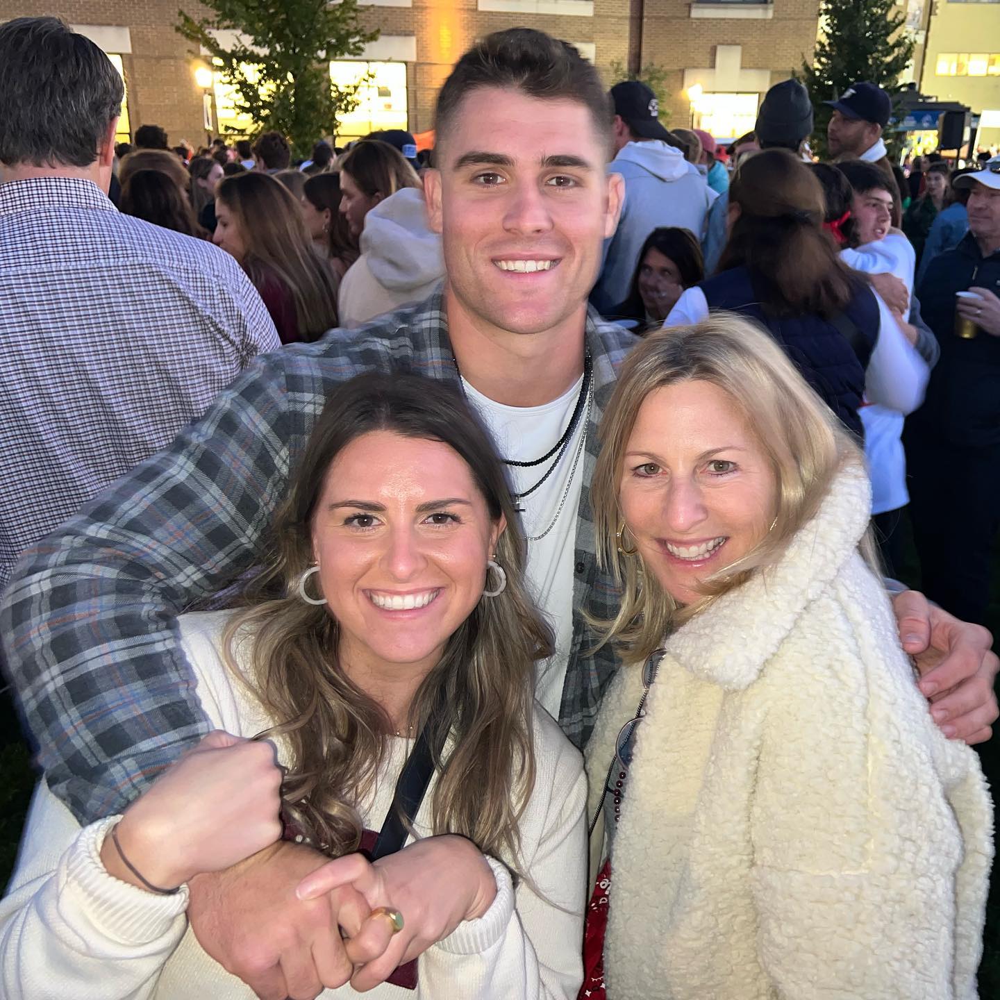 Billy Seidl posing with his mom and sister