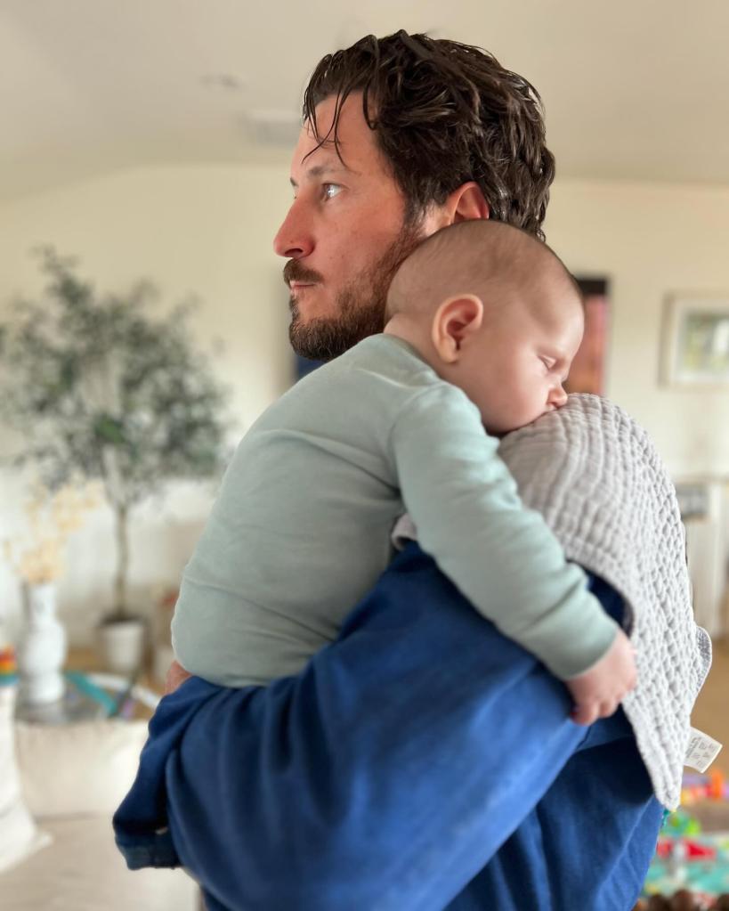 Val Chmerkovskiy holding his son