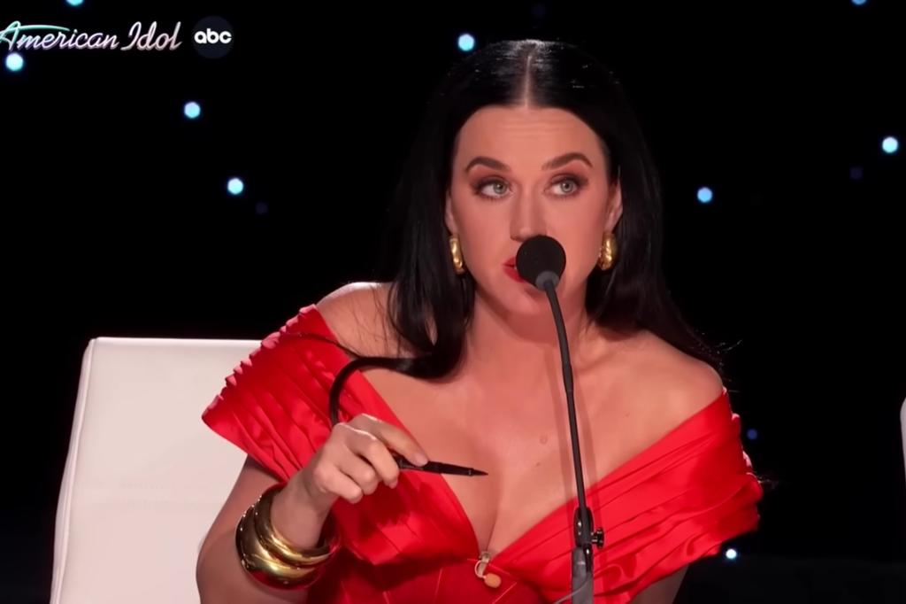 katy perry talking into a microphone