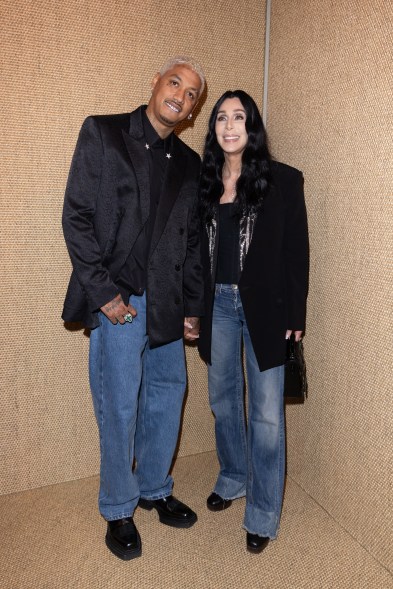 Alexander Edwards and Cher attend the Balmain show during Paris Fashion Week on Feb. 28, 2024.