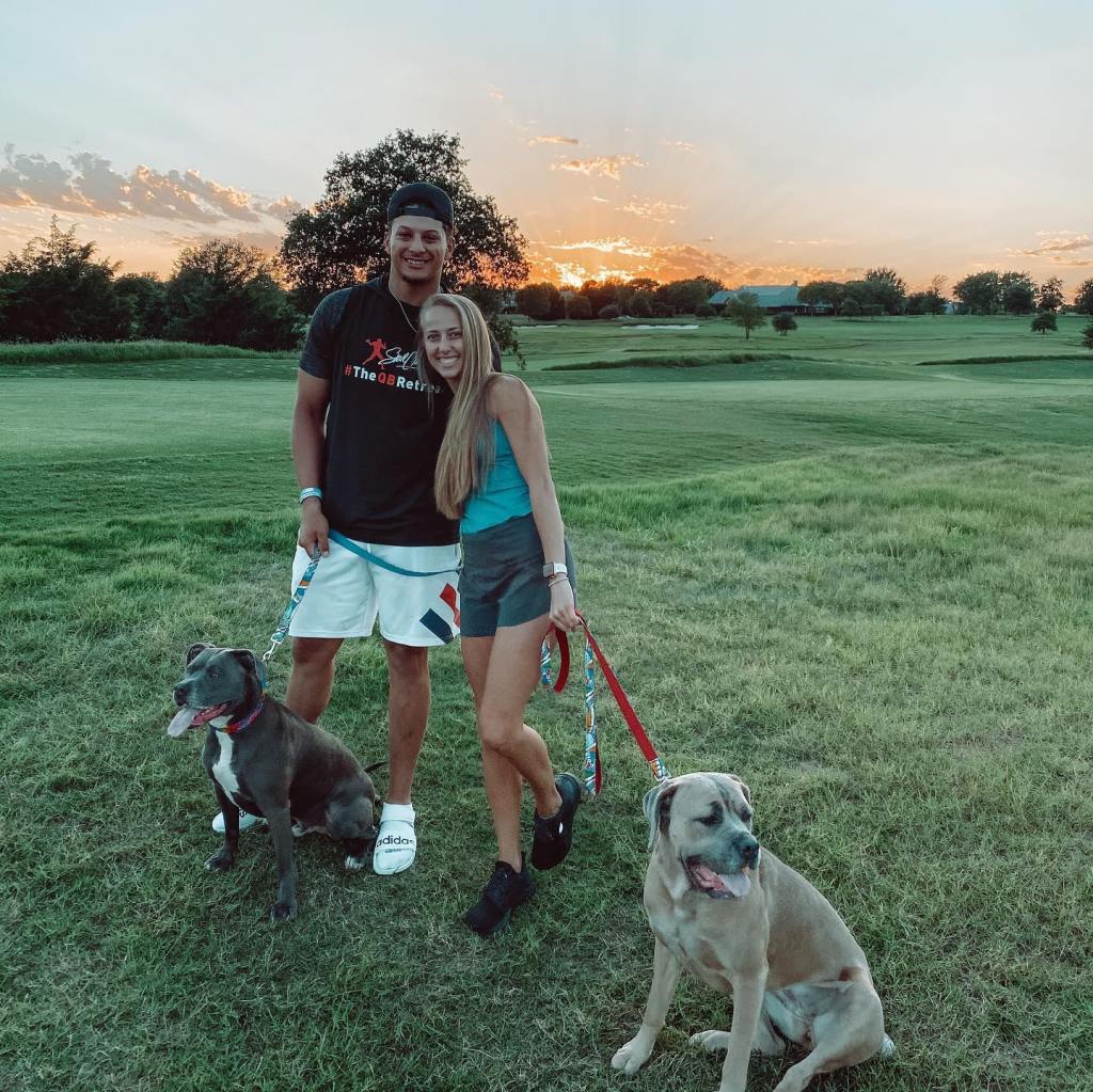 Patrick and Brittany Mahomes with their dogs