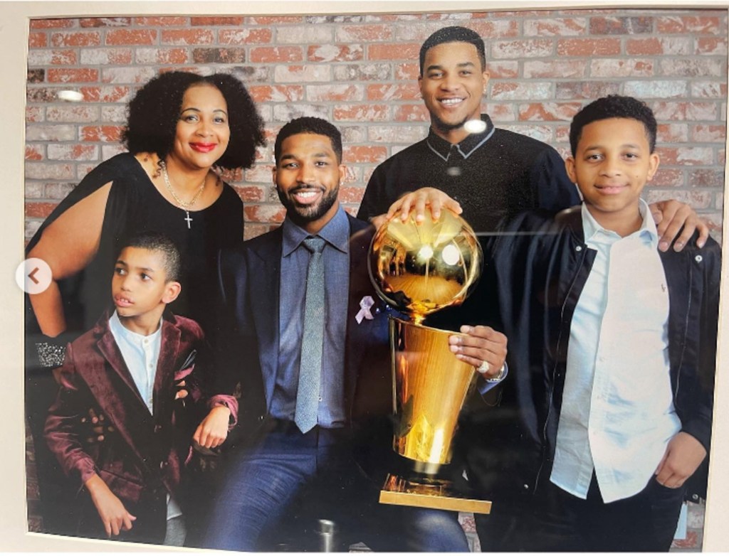 tristan thompson and his siblings with their mom and his basketball trophy