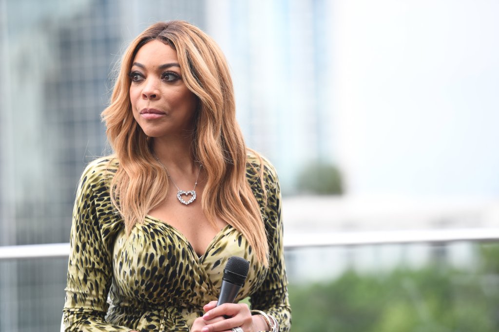 Wendy Williams holding a microphone.