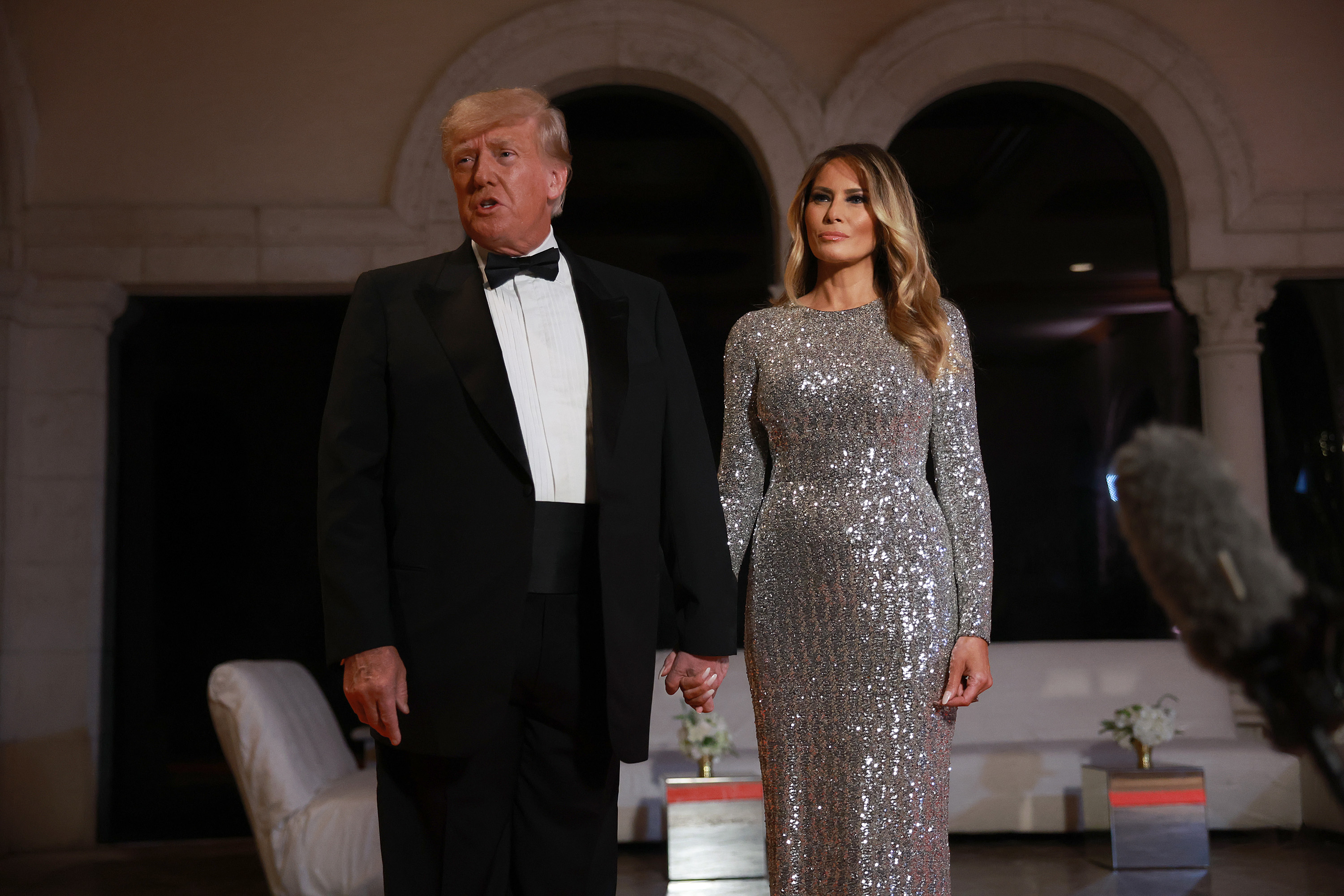 Donald Trump and Melania Trump dressed up at a gathering.