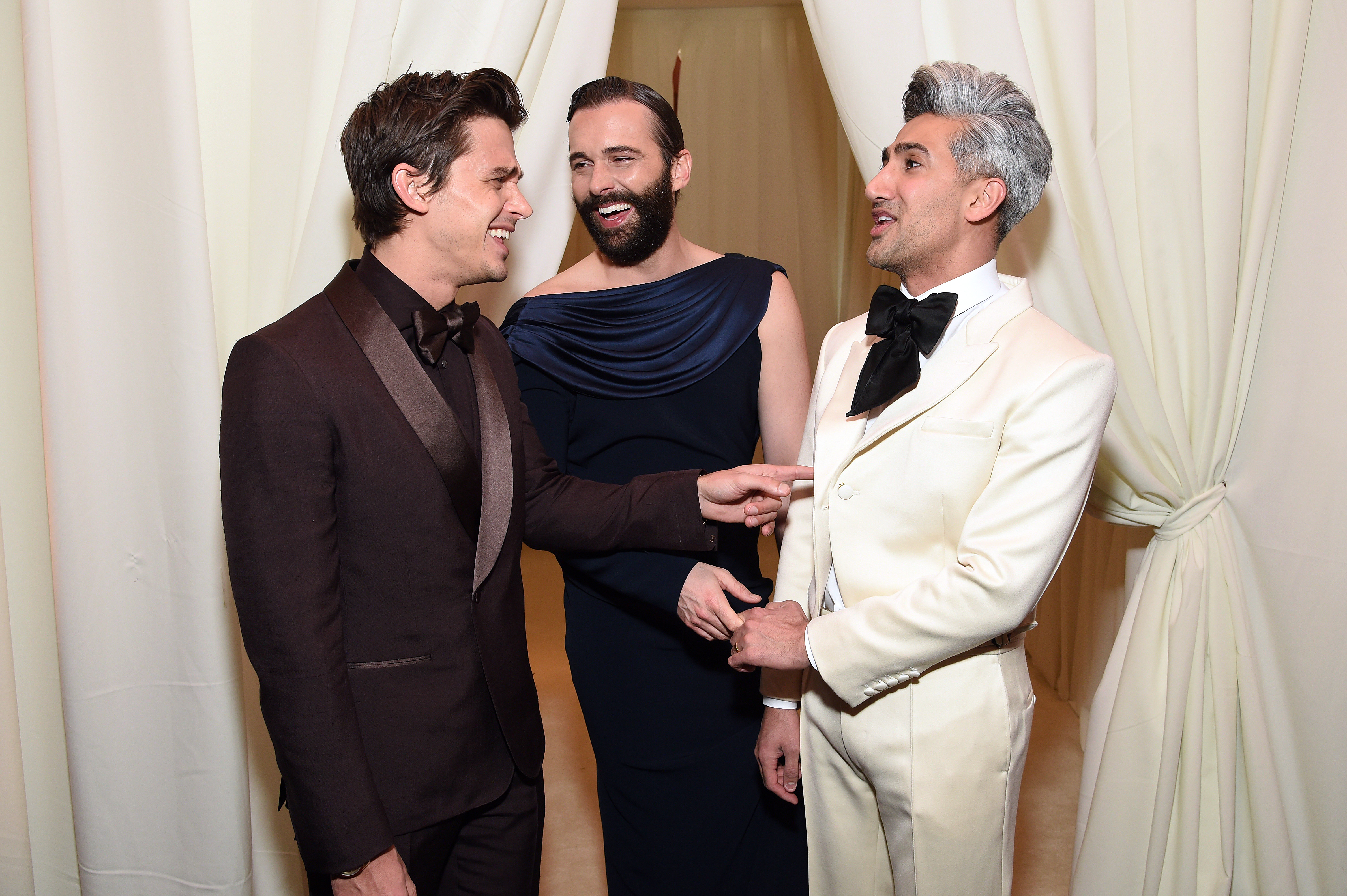 Antoni Porowski, Jonathan Van Ness and Tan France chatting.