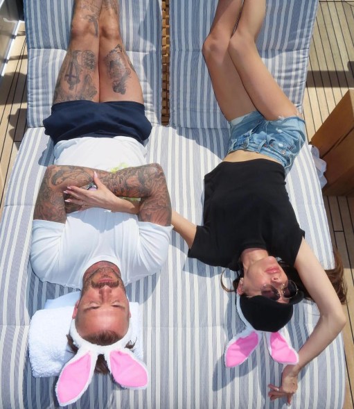 david and victoria beckham lying down wearing bunny ears