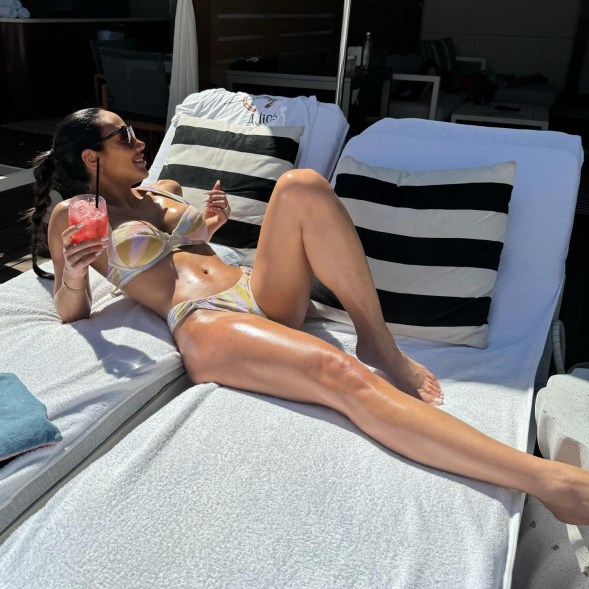 melissa gorga lounging in a bikini