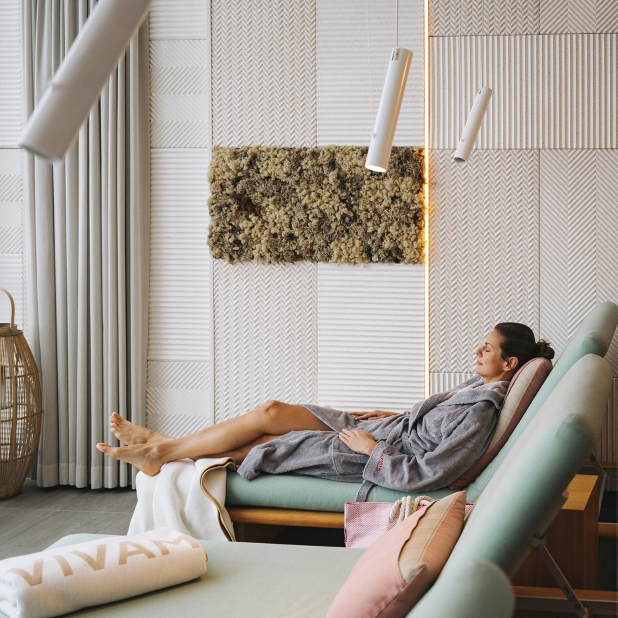 a woman lounging on a day bed