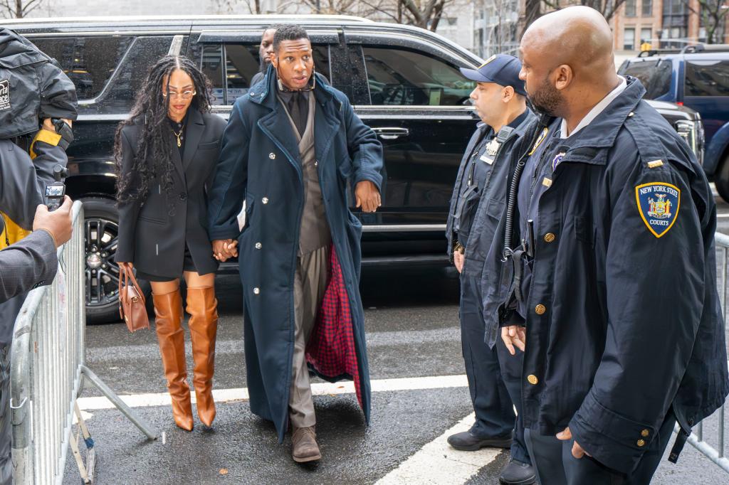 Meagan Good and Jonathan Majors arriving at trial.