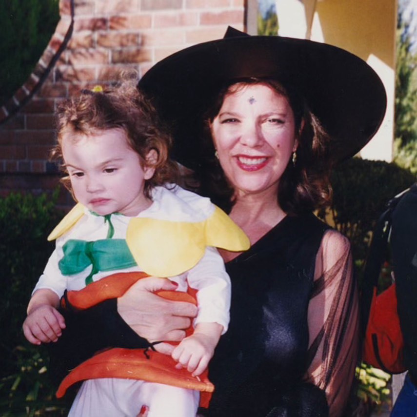 karen houghton holding her daughter in a halloween costume