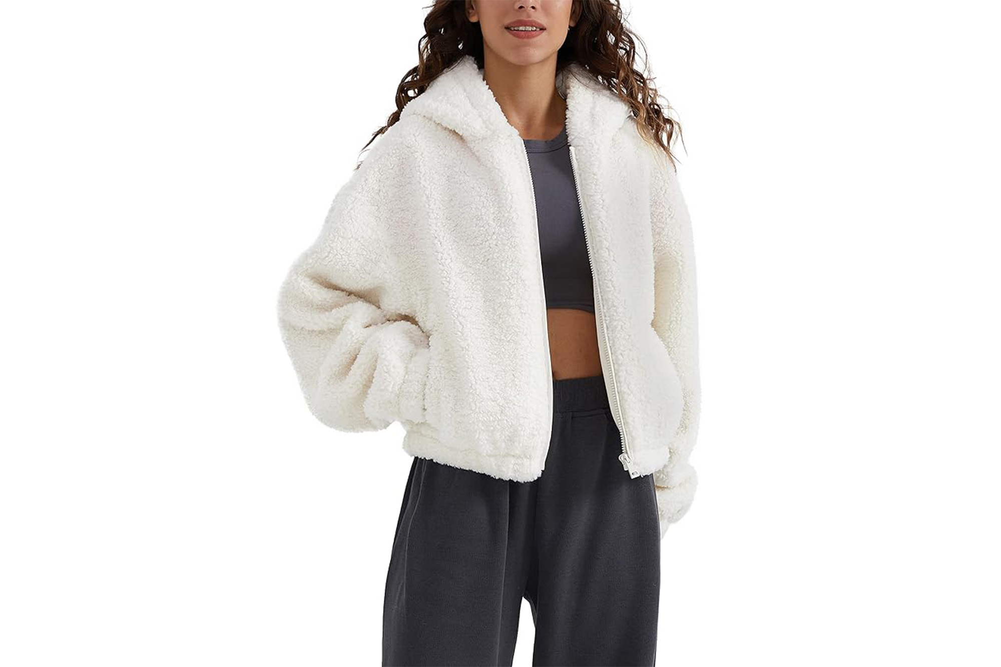 A model in a white furry cropped jacket