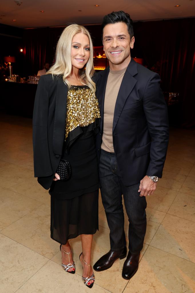 Kelly Ripa and Mark Consuelos posing together 