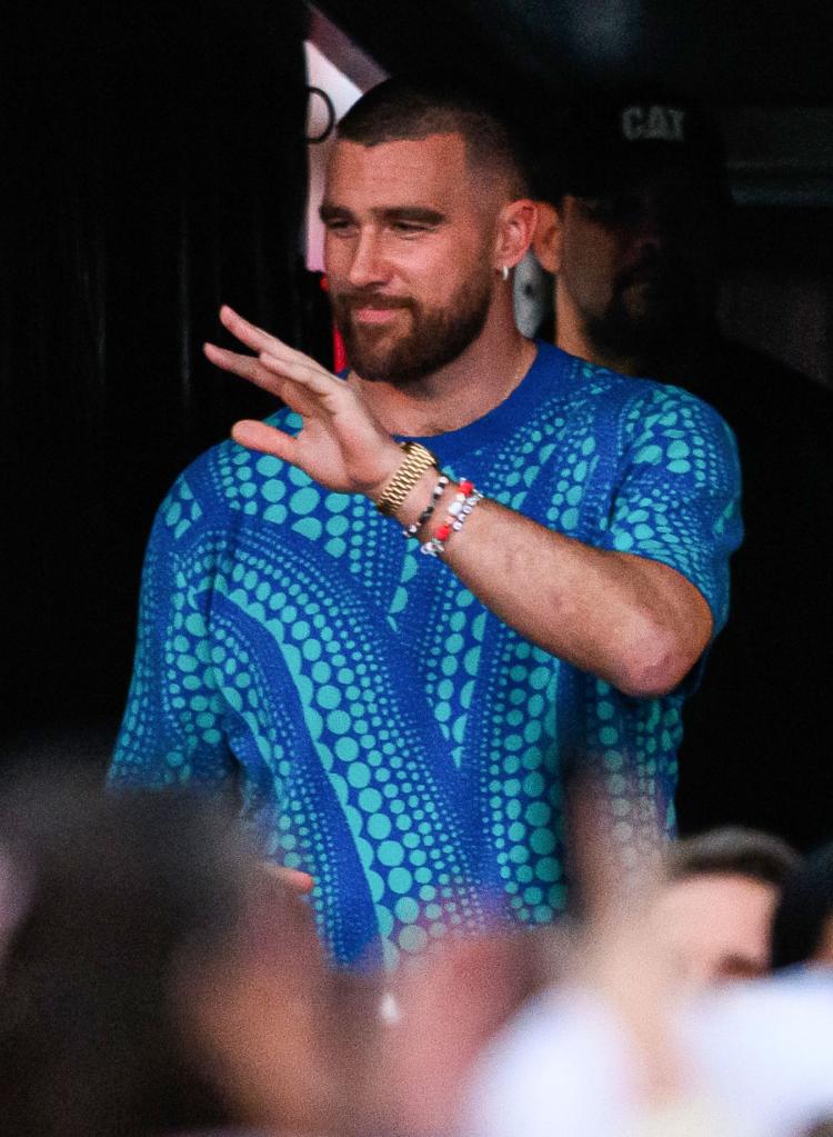 Travis Kelce in a blue shirt. 