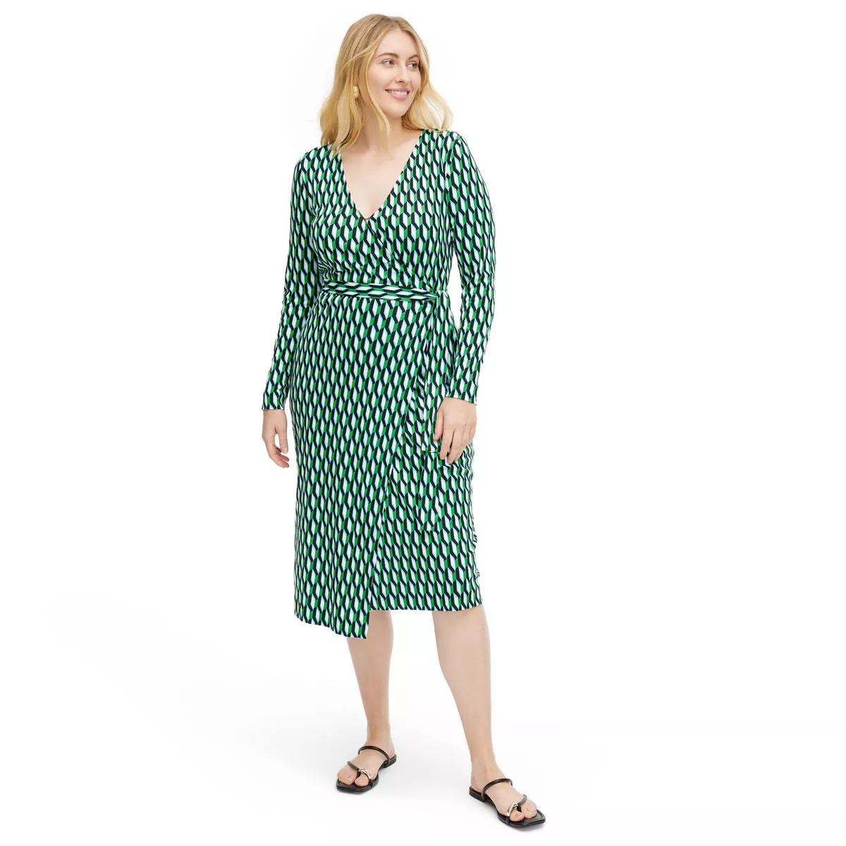 A model in a green wrap dress