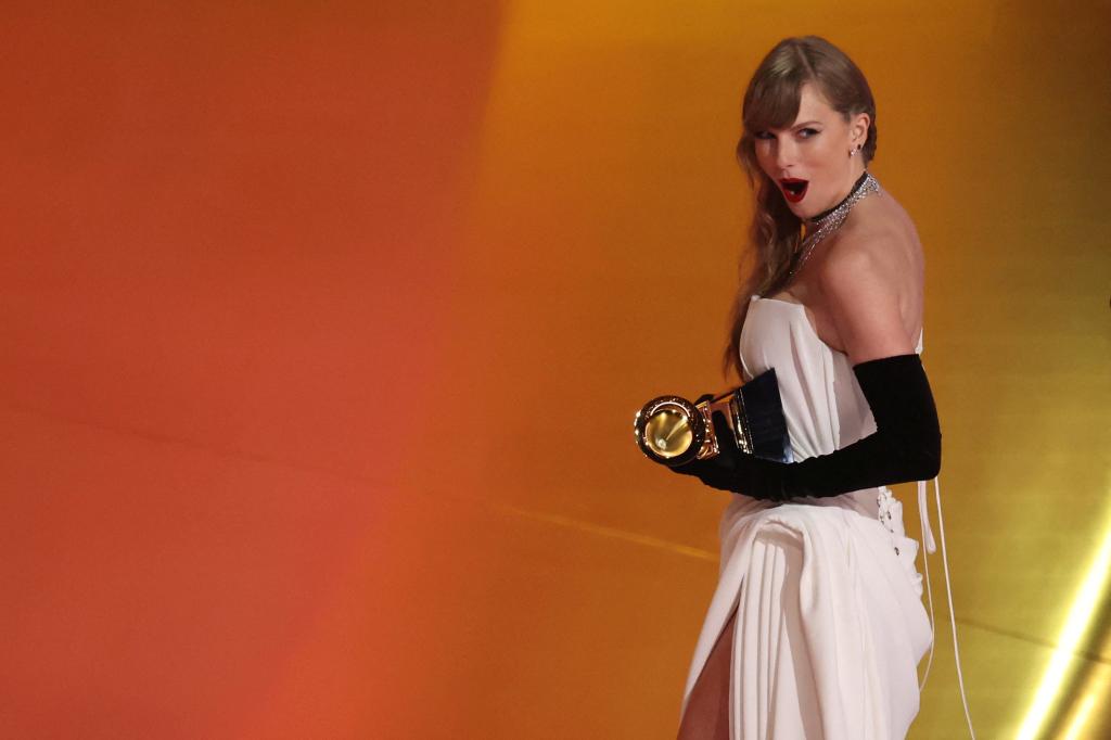 Taylor Swift accepts the Best Pop Vocal Album award at the 2024 Grammys