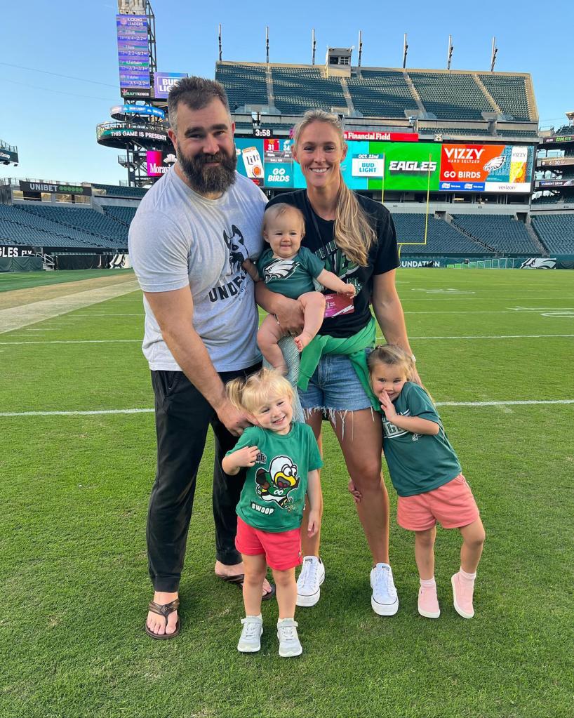 kylie and jason kelce with their daughters on the football field