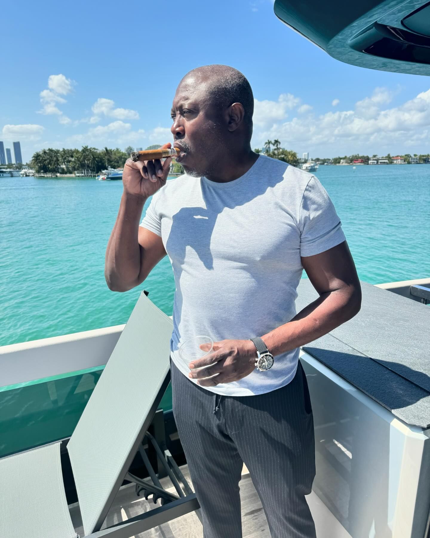 Simon Guobadia posing on a boat