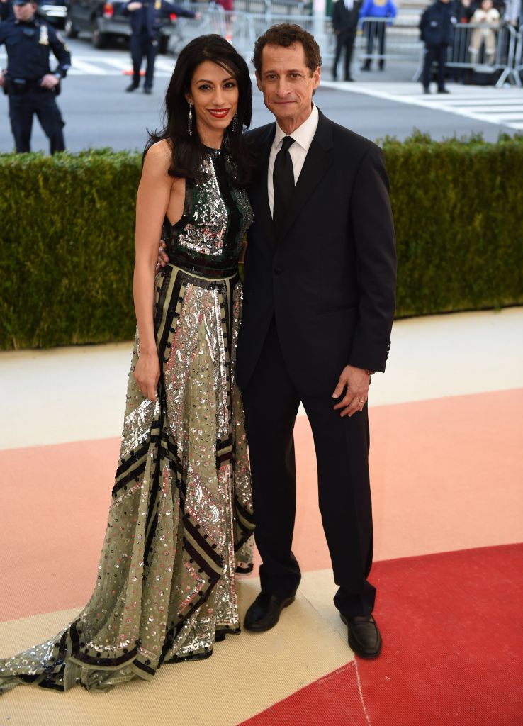 Huma Abedin hugs ex-husband Anthony Weiner on the Met Gala red carpet.