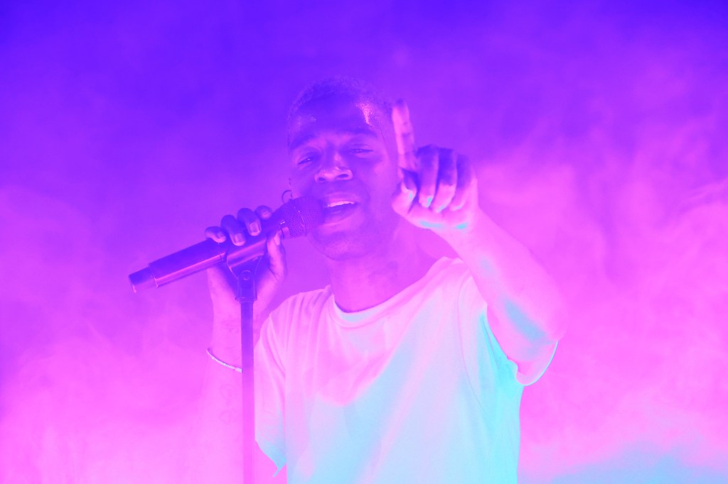 Kid Cudi performing on stage. 