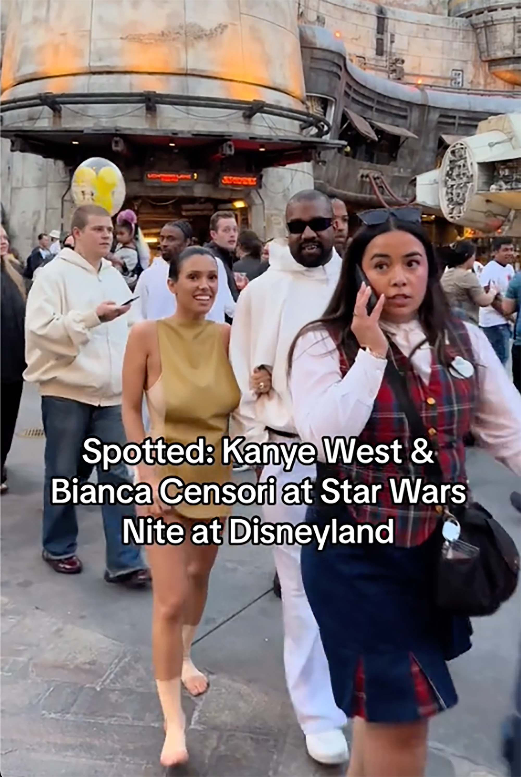 Bianca Censori and Kanye West in Disneyland.