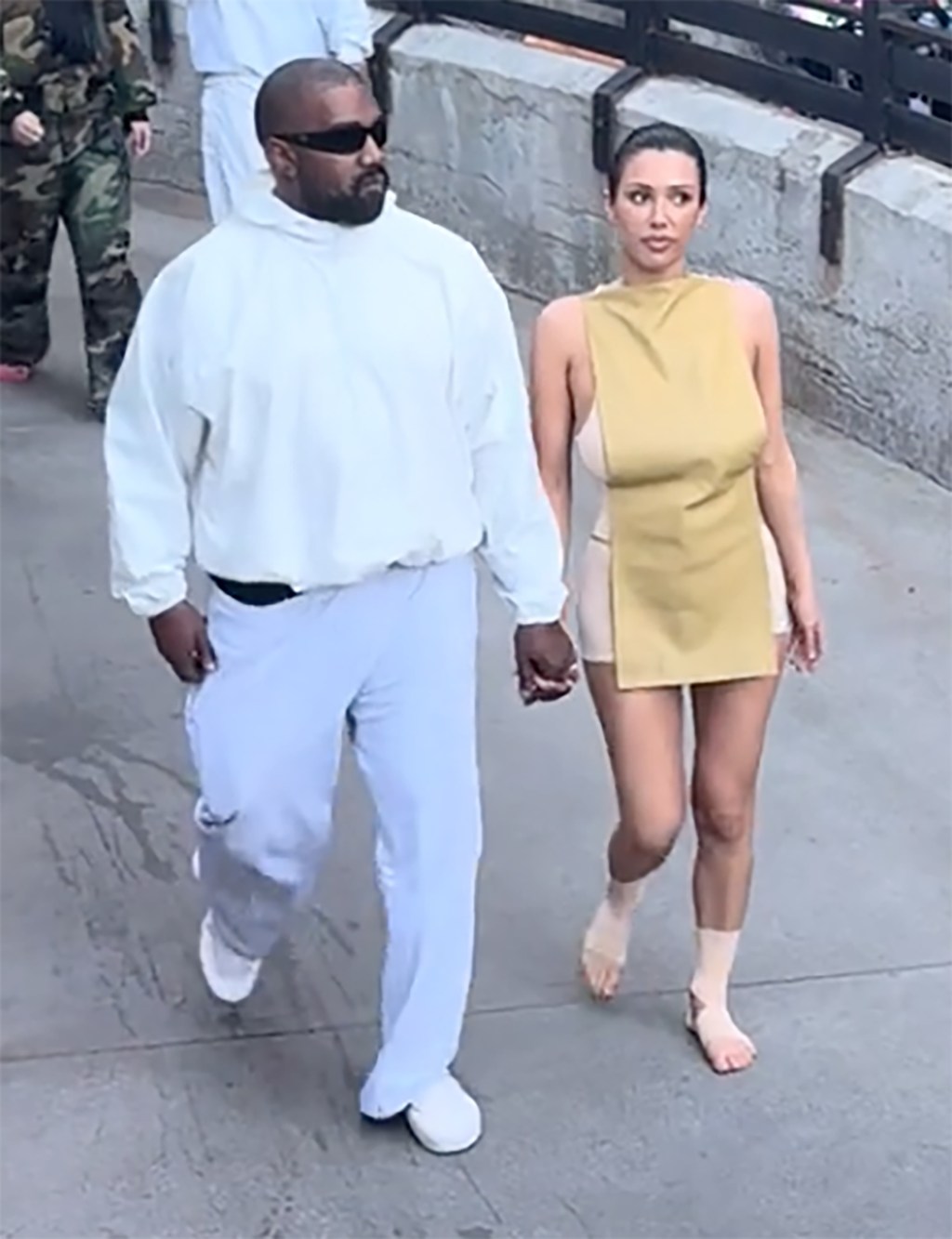 Bianca Censori and Kanye West in Disneyland.